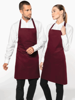 Tablier K8001 Kariban. Modèle léger en polycoton, pratique et confortable. Idéal pour la restauration, l’événementiel et la personnalisation textile.